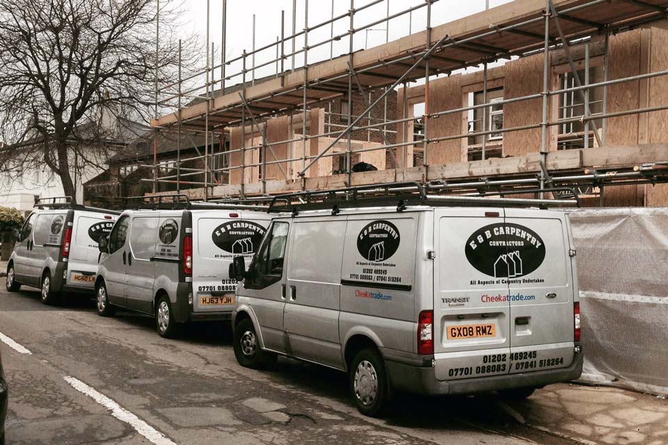 E&B Carpentry and Building Contractors - Vans at a building site